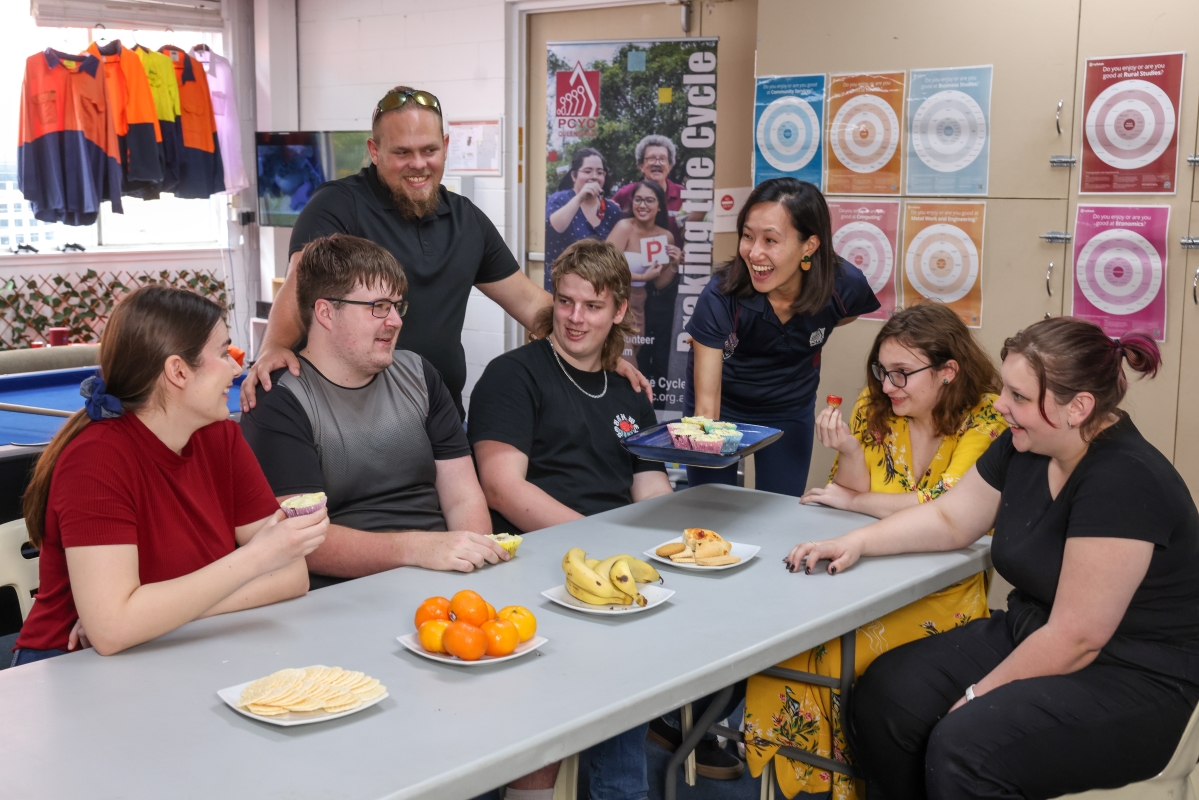 Get Set for Work - Group of People laughing with food in front of them
