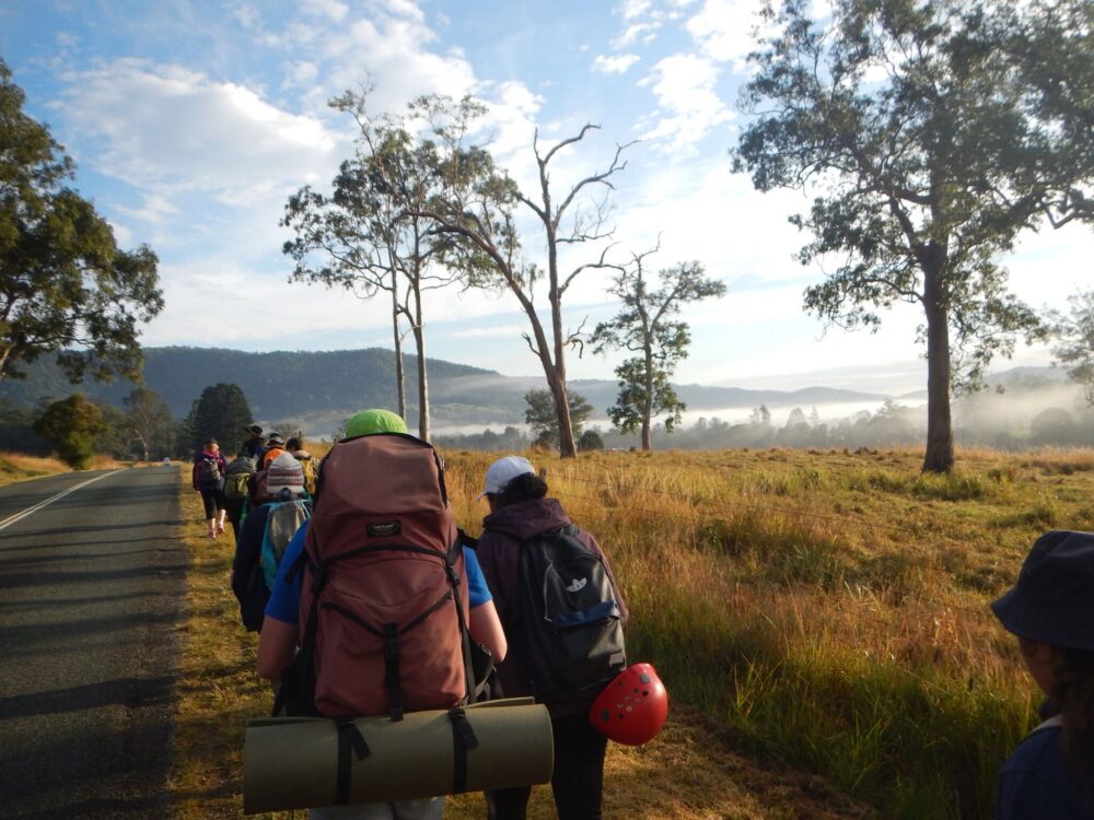 PCYC Team hiking alongside road