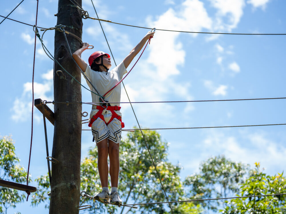 Girl starting treetop challenge