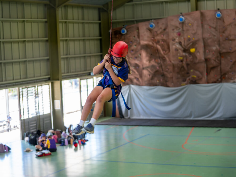 Girl swinging from rope